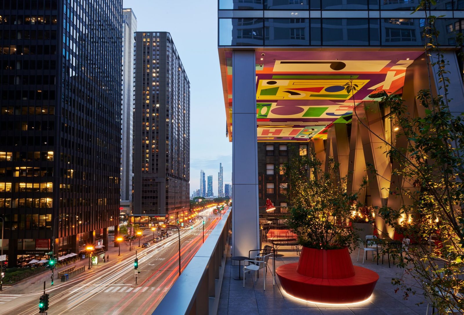 citizenM Chicago terrace at dusk — brand environment repeated across a global portfolio